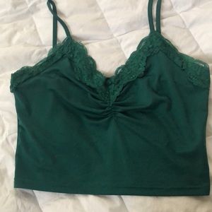 A green lace crop top